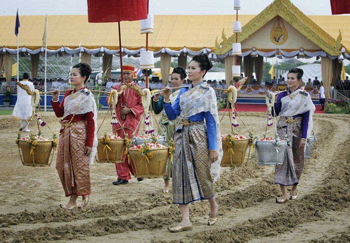 Two pairs of female guardians carry grain in gold and silver containers following behind the plow, seeding the tilled ground. (File photo)