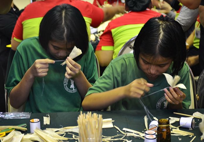 The blind students making daffodils.