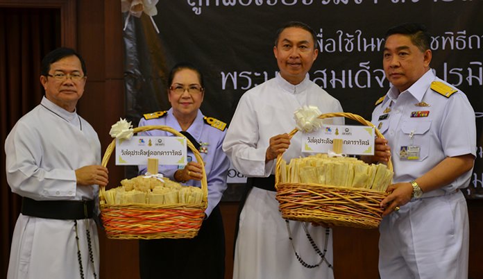 The Royal Thai Navy presented sandalwood to Father Michael and Father Peter.