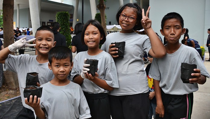 Youngsters from the Children’s Village with their marigold plants.