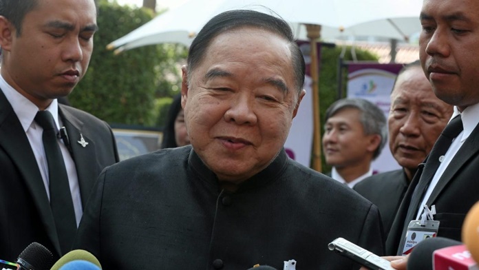 Deputy Prime Minister and Defense Minister Gen Prawit Wongsuwan talks to reporters in Bangkok, Saturday, Sept. 30.