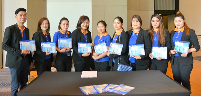 Bangkok Bank staff from several of their Pattaya Branches pose with copies of the Bank’s publication “Welcome to Bangkok Bank”, a guide for foreigners which is available at their branches.