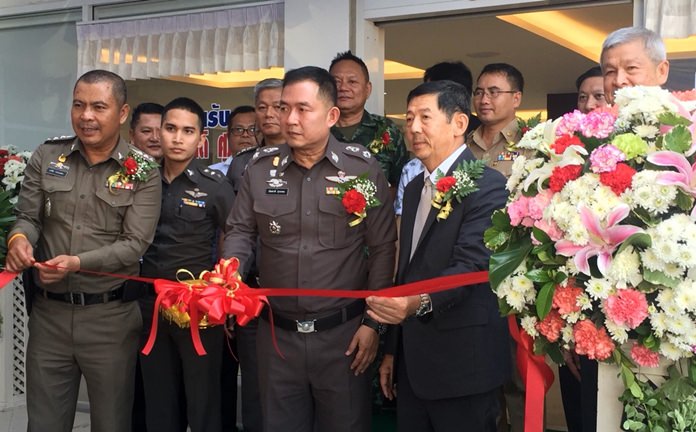 Chonburi’s police commander, Pol. Maj. Gen. Nantachart Supamongkol cuts the ribbon on the newly renovated Pattaya police station.