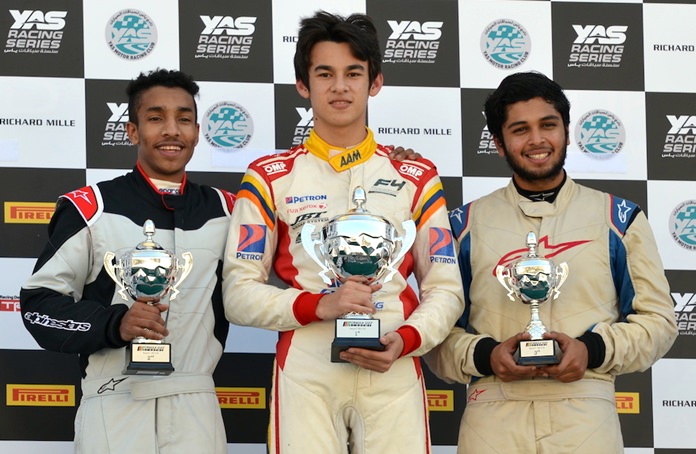 Kane Shepperd (center) stands on the podium after winning the Formula 4 South East Asia and Formula Gulf Championship race event in Abu Dhabi, Saturday, January 20.