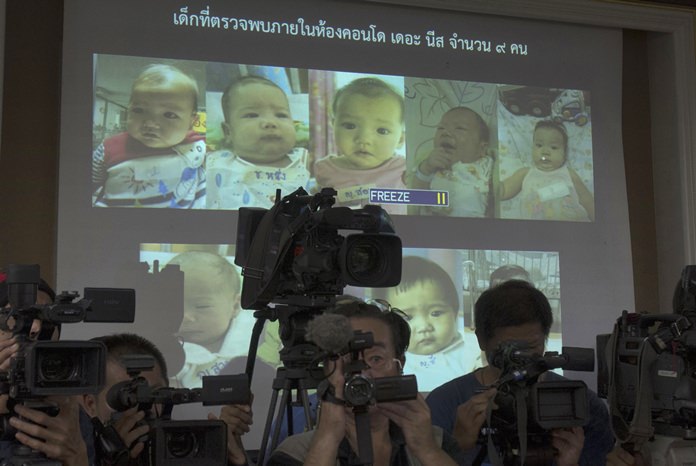 In this Aug. 12, 2014, file photo, the media attend a press briefing where Thai police display projected pictures of surrogate babies born to a Japanese man who is at the center of a surrogacy scandal during a press conference at the police headquarters in Chonburi. The Japanese father of the surrogate babies Mitsutoki Shigeta is the son of the founder of Japanese telecom and insurance company Hikari Tsushin and earns millions of dollars a year in dividends. (AP Photo/Sakchai Lalit, File)