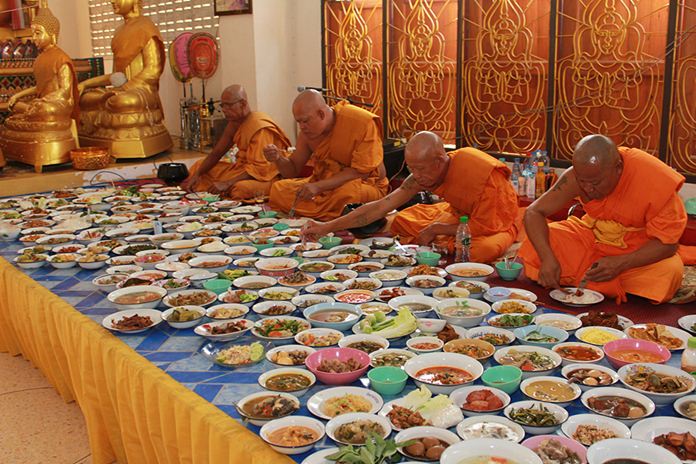 After the prayer sessions, monks partake in their daily meal offered by devout Buddhists.