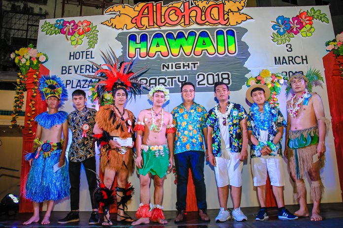 Managing Director Yod Boonyasatit (center) takes the stage with his Polynesian attired staff.