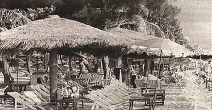 Pattaya Beach circa 1994, with its thatched umbrellas and tropical feeling.