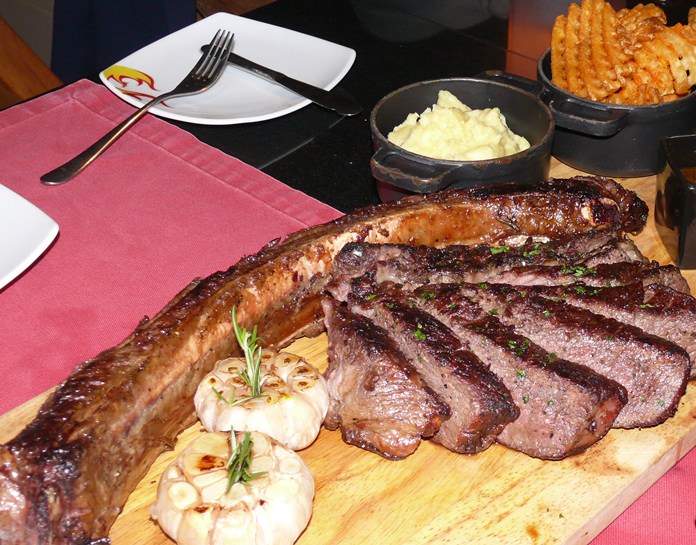 An enormous Tomahawk steak as devoured by Genghis Khan.