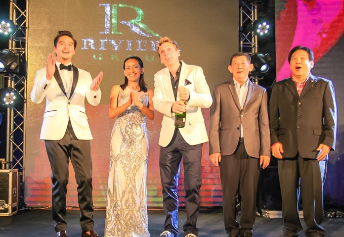 Winston Gale pops open the champagne bottle as Ananda Everingham, Sukanya Gale, Pattaya mayor Anan Charoenchasri and former MP Chanyut Hengtrakul celebrate the launch of Riviera Monaco.