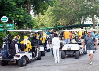 Golfers and caddies prepare before the start of the VFW’s 3rd Annual Charity Golf Tournament at Emerald Golf Club, Saturday, July 21.