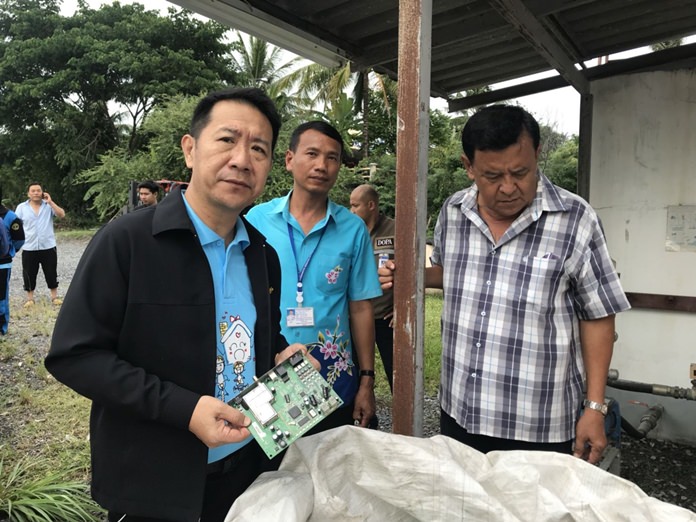 Banglamung District Chief Naris Niramaiwong looks suitably disgusted to find electronic waste in Takhiantia.