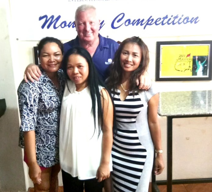 Brian Chapman (back) poses with the women winners on the day, Eng, Poopay, and Sasicha.