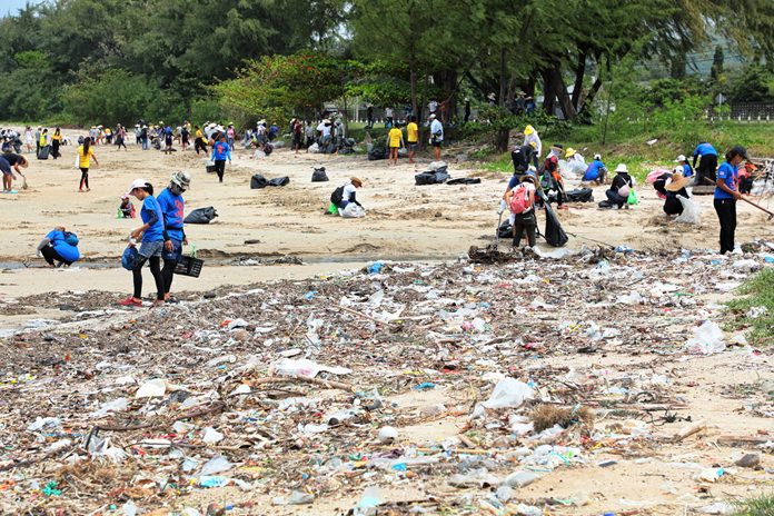 About 150 volunteers, athletes, sailors and residents have their work cut out trying to clean up this stretch of beach at the end of Tub Canal in Sattahip.