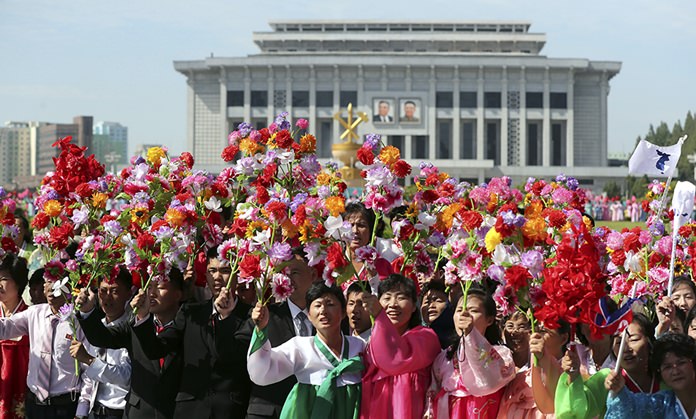 People fill the streets of Pyongyang to welcome South Korean President Moon Jae-in and the North Korean leader Kim Jong Un passing by during a car parade in North Korea. (Pyongyang Press Corps Pool via AP, File)