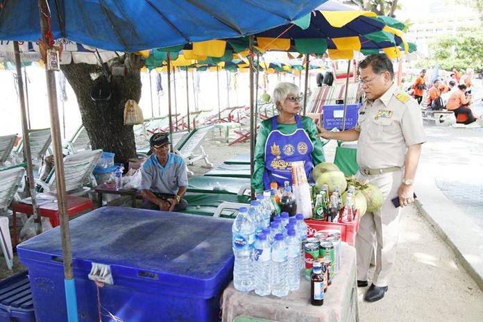 Deputy Mayor Vichien Pongpanit visits Pattaya beach vendors looking for anyone refusing to follow regulations on smoking and cleanliness.