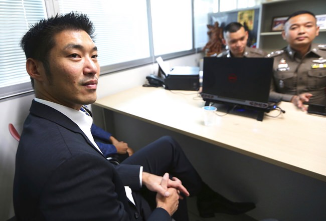 The leader of the political party named Future Forward Party, Thanathorn Juangroongruangkit arrives at the Technology Crime Suppression Division to hear police charges in Bangkok, Monday, Sept. 17. (AP Photo/Sakchai Lalit)