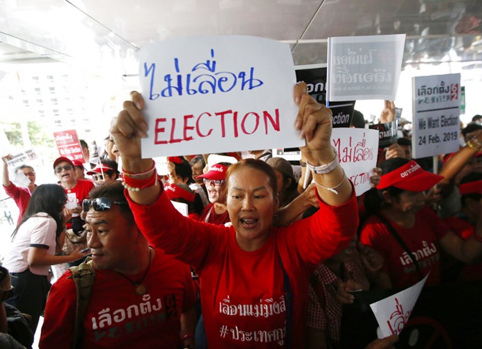 In this Tuesday, Jan. 8, 2019, file photo, demonstrators hold a rally demanding the general election not be postponed in Bangkok. (AP Photo/Sakchai Lalit)