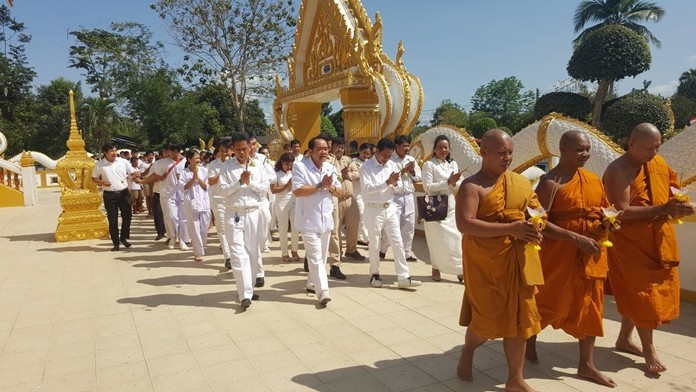 Nongprue sub-district Deputy Mayor Anak Pattanangam leads the procession at Samakkee Pracharam Temple.