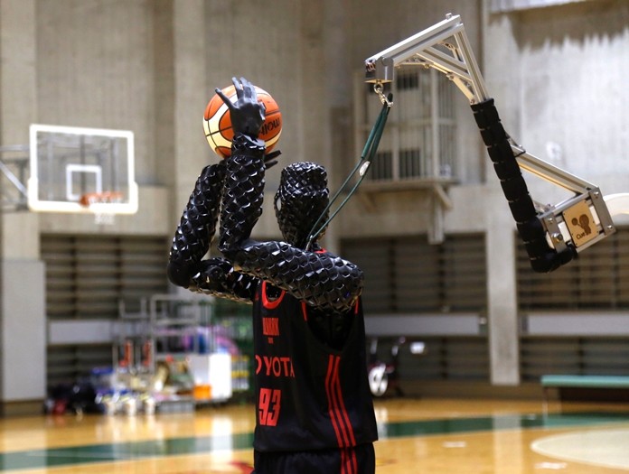 Toyota’s basketball robot Cue 3, the 207-centimeter (six-foot-10) -tall machine made five of eight three-pointer shots in a demonstration in a Tokyo suburb Monday, a ratio its engineers say is worse than usual. (AP Photo/Yuri Kageyama)