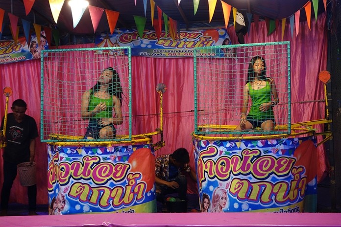 How’s your aim? Dunk a girl for charity at the Chaimongkol fair.