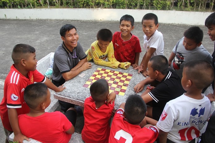 One teacher teaching the boys how to win.