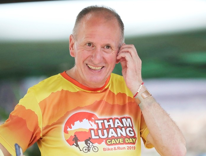 British cave expert Vernon Unsworth  participates in a marathon and biking event in Mae Sai, Chiang Rai province, Thailand, Sunday, June 23, 2019. Around 4,000 took part in the event Sunday morning, organized by local authorities to raise funds to improve conditions at the now famous Tham Luang cave complex. The youngsters went in to explore before rain-fed floodwaters pushed them deep inside the dark complex. Their rescue was hailed as nothing short of a miracle. (AP Photo/Sakchai Lalit)