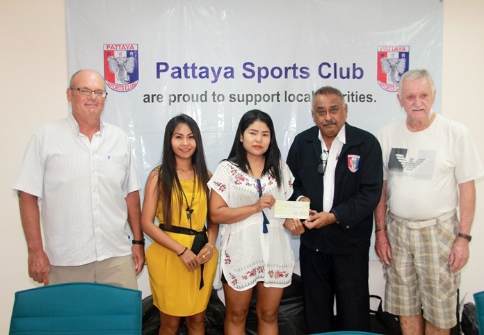 At a small gathering in the PSC clubhouse PSC President Peter Malhotra, together with Treasurer John Player, joined John O’Keefe in presenting a donation of 150,000 baht to Nittaya Daengchan, the mother of a 16-year-old boy afflicted with a heart valve problem.