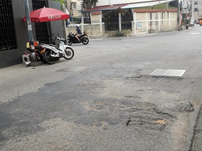 This photo taken July 30 shows the decaying road surface on Soi Bongkot 8.