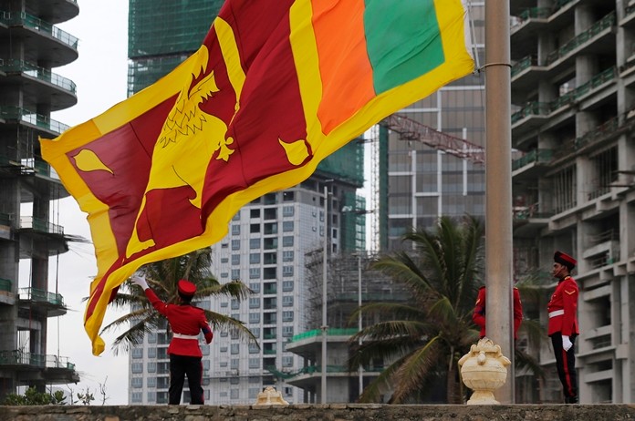 The Sri Lankan national flag flies at the popular landmark Galle Face in Colombo, Sri Lanka. (AP Photo/Eranga Jayawardena)