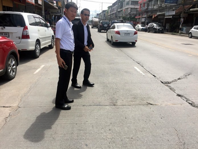 Pattaya Deputy Mayor Pattana Boonsawad leads a team of officials to inspect damaged sections on Thepprasit Road.