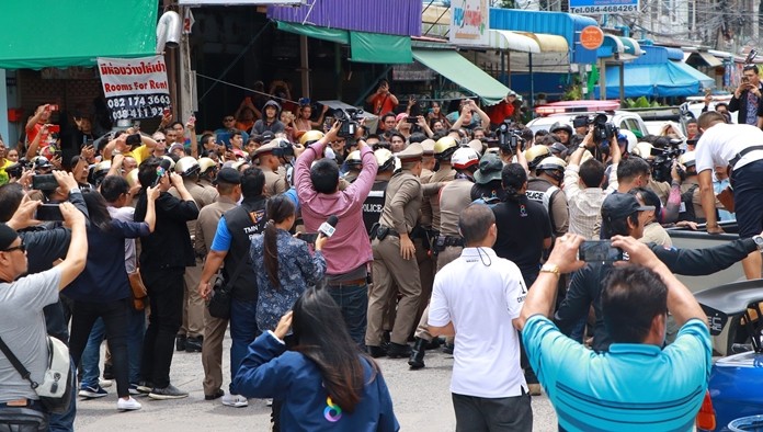 Over 200 police officers fitted with CCTVs on their helmets to record troublemakers were needed to hold back onlookers.