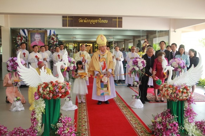 Bishop Silvio Siripong Charatsri, the Bishop of Chantaburi, cuts the ribbon at the grand opening of the new St. James Catholic Church at Maryvit School in Bowin, Sriracha.