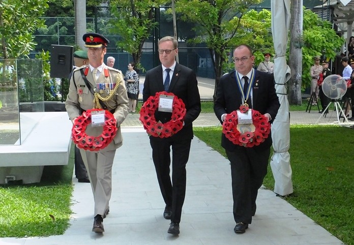 Colonel Roger Lewis, H.E. Brian Davidson, British Ambassador and Mark Bowling, President of the Royal British Legion lead the way in laying wreaths.