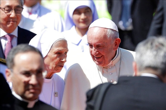 Pope Francis talks to his cousin Ana Rosa Sivori as he arrives at Military Air Terminal of Don Muang Airport, Wednesday, Nov. 20, 2019, in Bangkok, Thailand. (AP Photo/Gregorio Borgia)