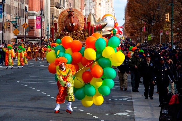 A clown with balloons fights with winds as it make its way down Columbus Circle during the Macy's Thanksgiving Day Parade, Thursday, Nov. 28, 2019, in New York. (AP Photo/Eduardo Munoz Alvarez)