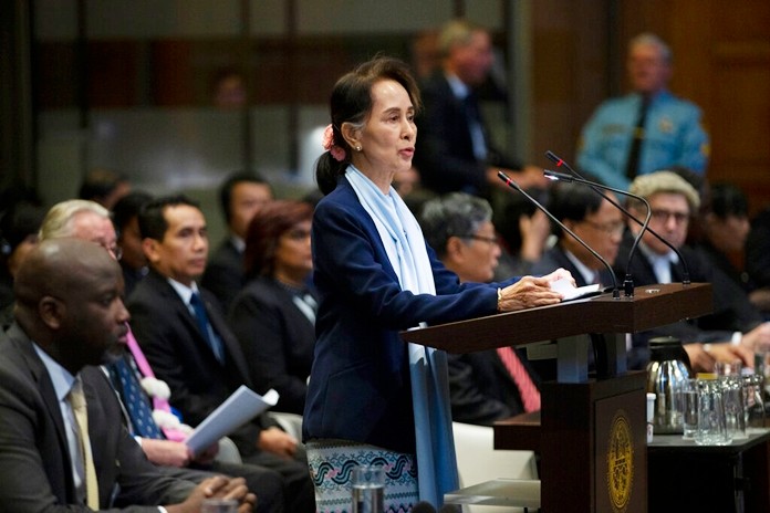 Myanmar's leader Aung San Suu Kyi addresses judges of the International Court of Justice for the second day of three days of hearings in The Hague, Netherlands, Wednesday, Dec. 11, 2019. (AP Photo/Peter Dejong)