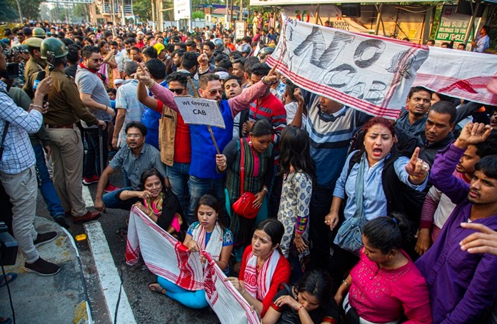 Protesters shout slogans against the Citizenship Amendment Bill (CAB) in Gauhati, India, Wednesday, Dec. 11, 2019. (AP Photo/Anupam Nath)