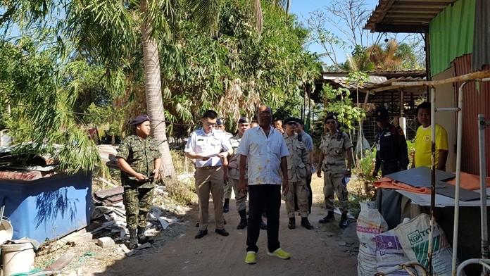 Takhiantia sub-district Mayor Manop Prokobthum (center) brought Takhiantia officials to demolish homes cited for encroaching on public forestland the sub-district plans to turn into a park.