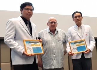 MC Les Edmonds (center) presents Dr. Tanakorn (on his right) and Dr. Natchai (on his left) with the PCEC's Certificate of Appreciation for their enlightening talk about the seriousness of a stroke, its treatment, and rehabilitation.