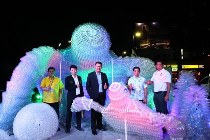 Officials unveil the ironic new landmark, a sculpture of two leatherback turtles made of the very plastic that has helped put them on the endangered-species list.