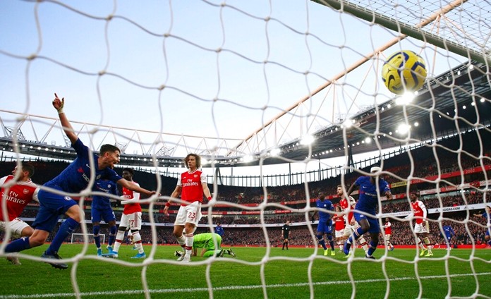 Chelsea's Jorginho, left, celebrates after scoring his side's first goal during the English Premier League soccer match between Arsenal and Chelsea, at the Emirates Stadium in London, Sunday, Dec. 29, 2019. (AP Photo/Ian Walton)