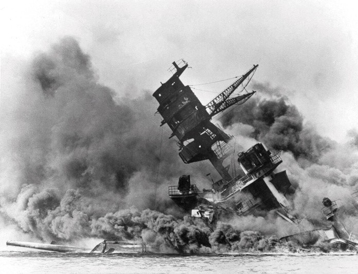 In this Dec. 7, 1941 file photo, smoke rises from the battleship USS Arizona as it sinks during the Japanese attack on Pearl Harbor, Hawaii. (AP Photo, File)