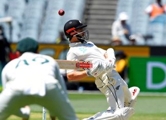 New Zealand's Kane Williamson avoids a bouncer from Australia's Pat Cummins during their cricket test match in Melbourne, Australia, Sunday, Dec. 29, 2019. With the three-test series between Australia and New Zealand decided, players from both teams will momentarily turn their attention away from the pitch at the Sydney Cricket Ground and to the deadly wildfires around the country. (AP Photo/Andy Brownbill)