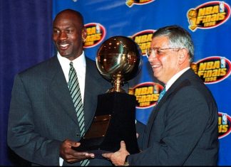 In this June 18, 1996, file photo, Chicago Bulls' Michael Jordan, left, receives the NBA Finals Most Valuable Player trophy from Commissioner David Stern during a ceremony in Chicago. (AP Photo/Charles Bennett, File)