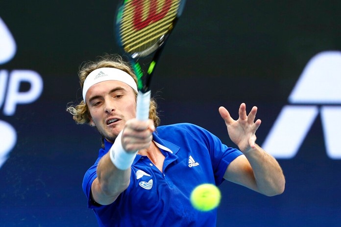 Stefanos Tsitsipas of Greece plays a shot during his match against Denis Shapovalov of Canada at the ATP Cup tennis tournament in Brisbane, Australia, Friday, Jan. 3, 2020. (AP Photo/Tertius Pickard)