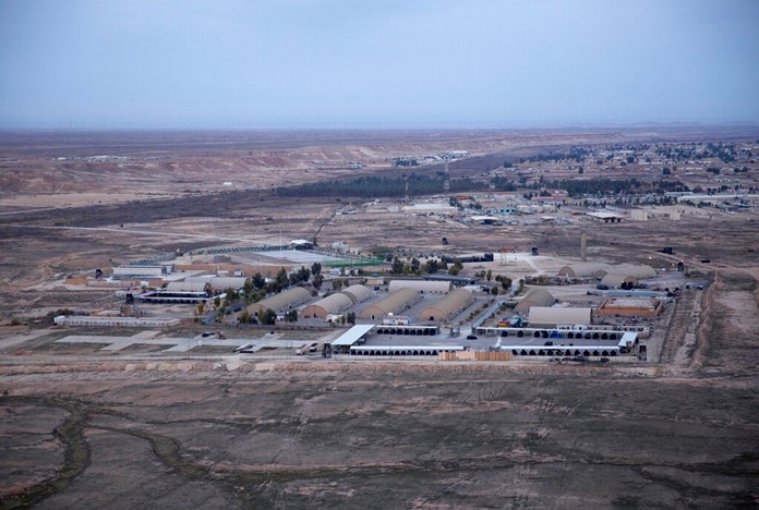 In this Sunday, Dec. 29, 2019 file photo taken from a helicopter shows Ain al-Asad air base in the western Anbar desert, Iraq.(AP Photo/Nasser Nasser, File)