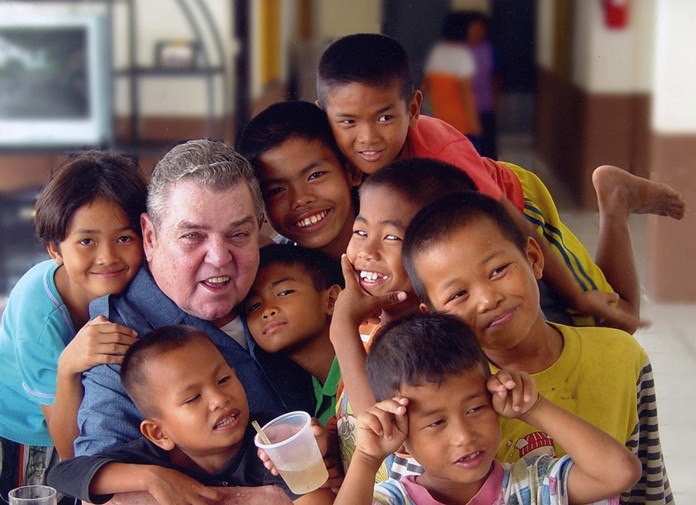 Father Ray with his former street kids.