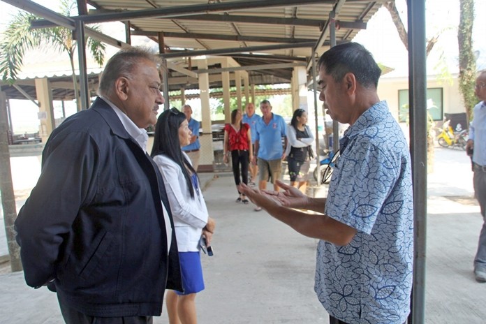 School director Apiwat Jaiyungyuen speaks to Pres. Peter Malhotra about the needs of the school.