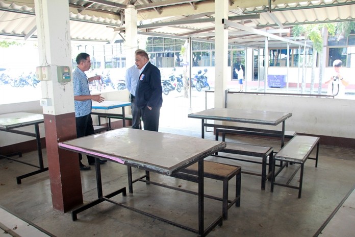 Apiwat Jaiyungyuen takes the committee on a tour of the dining facilities.